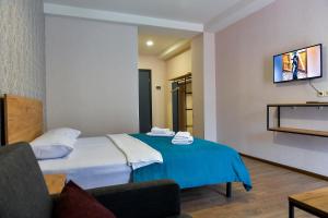 Voodi või voodid majutusasutuse Tskaltubo Epic Hotel & Spa toas