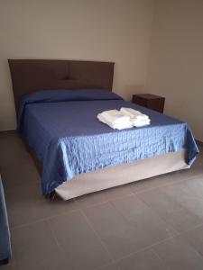 A bed or beds in a room at Le Zagare b&b