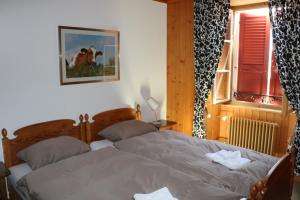 Postel nebo postele na pokoji v ubytování Auberge de l'Ange