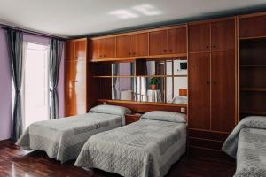 En eller flere senger på et rom på Pensión Amaia H VI 00348