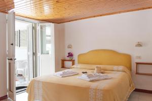 Katil atau katil-katil dalam bilik di Hotel la Maggioressa