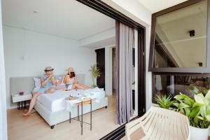 Ein Bett oder Betten in einem Zimmer der Unterkunft Rea Boutique Hotel