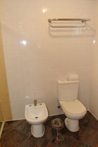 a bathroom with a toilet and a bidet at Sol Alphaville Hotel & Residence in Barueri