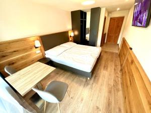 Postel nebo postele na pokoji v ubytování Villa Pinus Slovenský raj - Hotel Čingov dependance