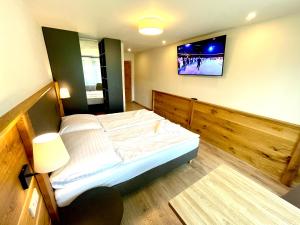 Postel nebo postele na pokoji v ubytování Villa Pinus Slovenský raj - Hotel Čingov dependance