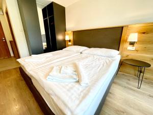 Postel nebo postele na pokoji v ubytování Villa Pinus Slovenský raj - Hotel Čingov dependance