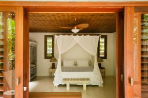 A bed or beds in a room at Pousada Capim Santo