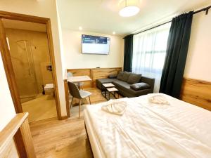 Postel nebo postele na pokoji v ubytování Villa Pinus Slovenský raj - Hotel Čingov dependance