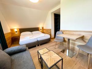 Postel nebo postele na pokoji v ubytování Villa Pinus Slovenský raj - Hotel Čingov dependance