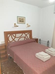 Posteľ alebo postele v izbe v ubytovaní Apartamento Acogedor en Los Patios De San Basilio