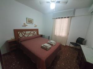 Posteľ alebo postele v izbe v ubytovaní Apartamento Acogedor en Los Patios De San Basilio
