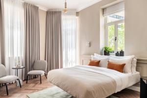 Un pat sau paturi într-o cameră la Hotel Noel Jerusalem