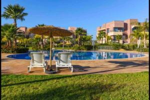 Bazén v ubytování Cosy Loft Emeraude Marrakech Prestigia Golf City nebo v jeho okolí