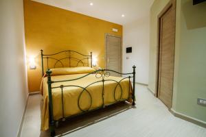 Ένα ή περισσότερα κρεβάτια σε δωμάτιο στο La Suite del Faro