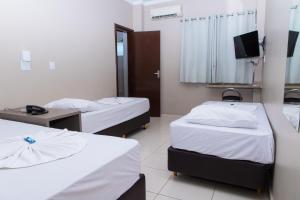TV a/nebo společenská místnost v ubytování Hotel Astória Maringá