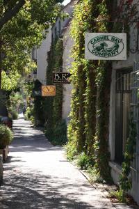 a street with a sign on the side of a building at Coachman's Inn, A Four Sisters Inn in Carmel