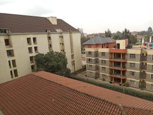 an overhead view of some buildings with red roofs at Jayson Furnished Apartment, Nairobi in Nairobi