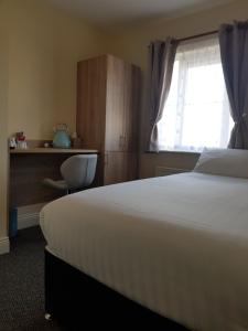 Postel nebo postele na pokoji v ubytování Bella Room with free minibar tea&coffee