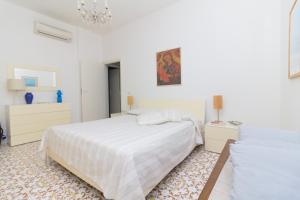 Giường trong phòng chung tại Villa Carlotta - Relax a due passi dal mare