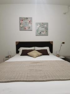Postel nebo postele na pokoji v ubytování Angolo di Eden