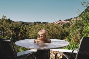 a small table with a head on top of it at Dimoulitsa Villas Complex in Doukádes +40 photos