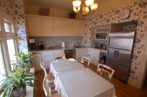 a kitchen with a table and a refrigerator at Jackson Court in San Francisco