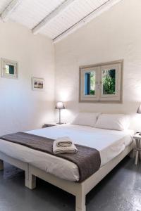 Postel nebo postele na pokoji v ubytování Dimoulitsa Villas Complex