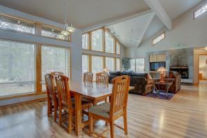 a living room with a wooden table and chairs at 1 Colonial in Sunriver