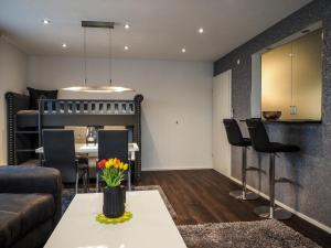 a living room with a couch and a table at Ferienwohnung Langlitz in Rust
