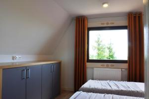 Postel nebo postele na pokoji v ubytování TATRY NA WYPASIE
