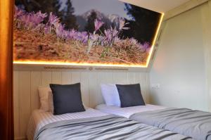 Postel nebo postele na pokoji v ubytování TATRY NA WYPASIE