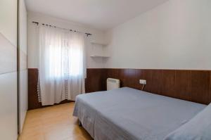 Ein Bett oder Betten in einem Zimmer der Unterkunft Club Villamar - Merlot