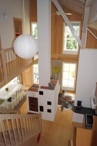 a living room with a staircase and a ceiling at Ferienhaus Albrecht in Egg