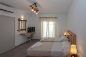 A bed or beds in a room at Petra Aqua Villa
