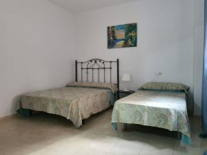 Apartamento PUERTO客房内的一张或多张床位