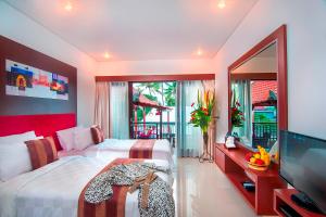 Postel nebo postele na pokoji v ubytování The Swaha Ubud Hotel