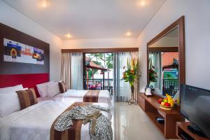 Postel nebo postele na pokoji v ubytování The Swaha Ubud Hotel