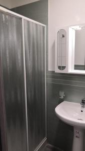 a bathroom with a shower and a sink at Maria e Antonio Blu in Castellammare di Stabia