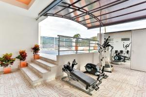 a fitness room with a gym with stairs and a treadmill at Casablanca Hotel, RestoBar, Catering, Eventos & Turismo en Garzón in Garzón