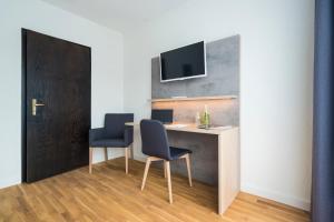 TV a/nebo společenská místnost v ubytování 2Places Side