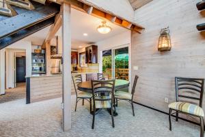 a kitchen and dining room with a table and chairs at Captain's Quarter in Johnson Landing