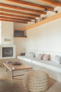 A television and/or entertainment centre at Avdos' olive house - land tales