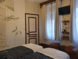Кровать или кровати в номере B & B Les Secrets des Loges