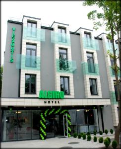 an office building with a sign for a hotel at Algiro Hotel in Kaunas