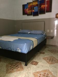 Katil atau katil-katil dalam bilik di HOTEL LA CASONA