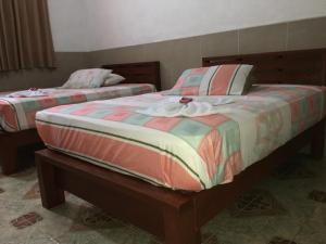 Ліжко або ліжка в номері HOTEL LA CASONA