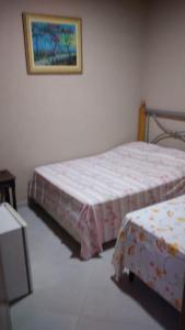 Katil atau katil-katil dalam bilik di Pousada voo livre