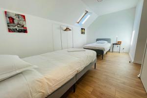 Katil atau katil-katil dalam bilik di Maison rénovée dans quartier résidentiel aux portes de Tours