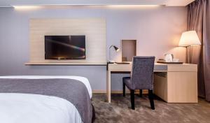 Postel nebo postele na pokoji v ubytování Hotel Shalom Jeju