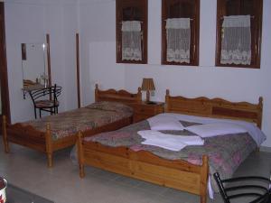 A bed or beds in a room at Anastasia